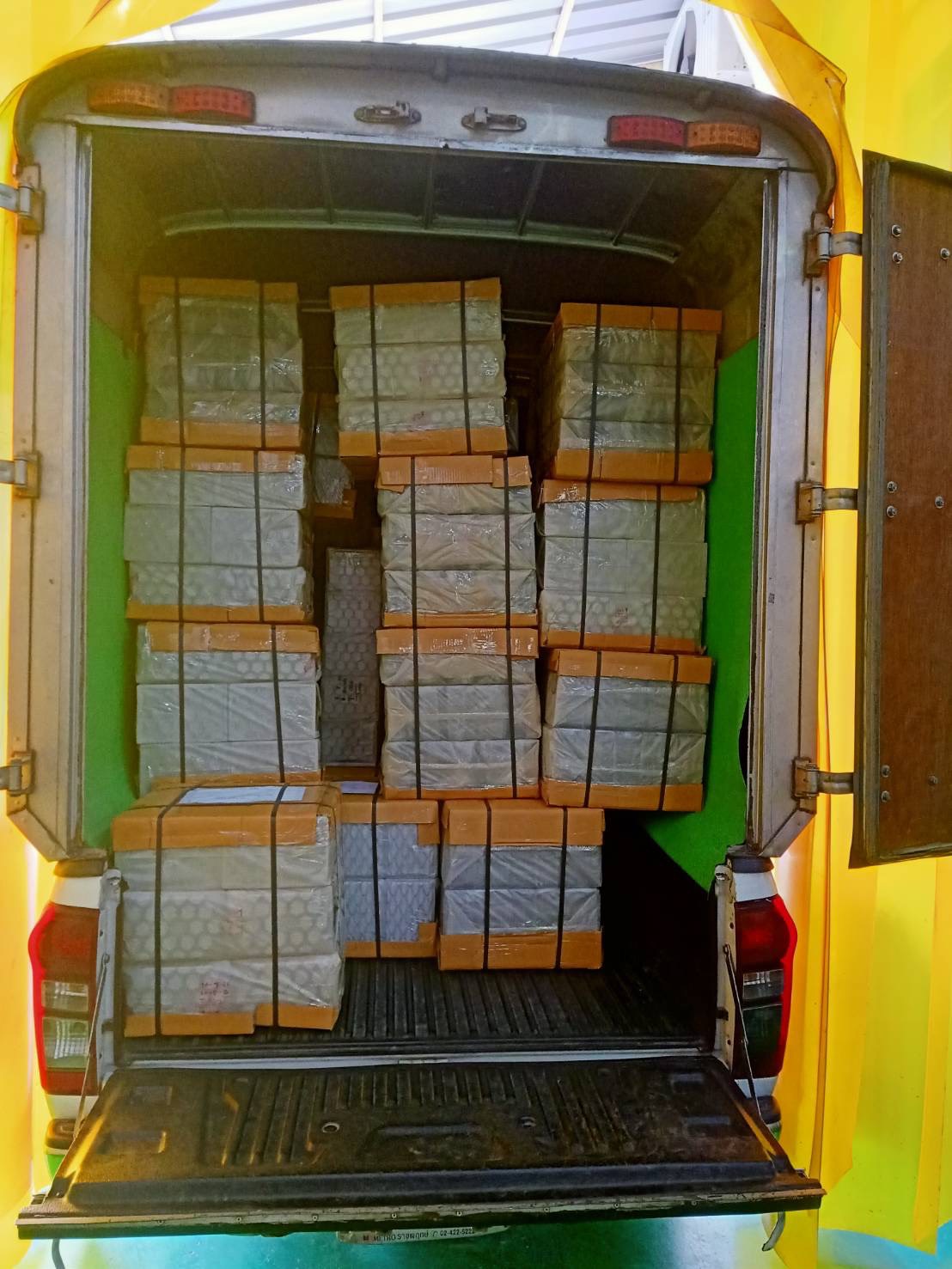 Delivery van loaded with packed cartons